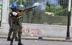 UN-troops-fire-tear-gas-at-Haitian-protesters-Titid-graffiti-by-United-Nations-Photo-300x187, Et tu, Brute? Haiti’s betrayal by Latin America, World News & Views 