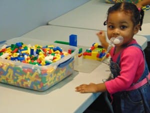 Morris-Turner’s-granddtr-Amaya-plays-legos-at-Space-Center-300x225, Grandfatherhood: A second chance to get it right, Culture Currents 