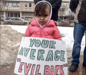 Your-Average-Evil-Doer-lil-girl-protests-Canadian-Anti-Terrorism-Act-in-Saskatoon-Saskatchewan-031415-300x264, A terrorist under every bed in Canada, World News & Views 
