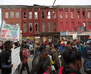 Baltimore-Freddie-Gray-march-past-dilapidated-bldgs-0415-300x245, Stand with the defiant ones in Baltimore, News & Views 