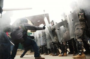 Baltimore-Freddie-Gray-protesters-face-cops-042715-web-300x199, Stand with the defiant ones in Baltimore, News & Views 