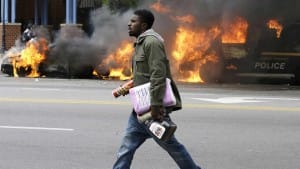 Baltimore-Freddie-Gray-youth-carrying-store-items-walks-past-burning-police-vehicles-042715-300x169, Stand with the defiant ones in Baltimore, News & Views 