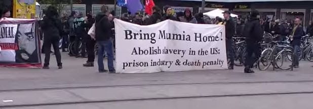 Mumia-Abu-Jamal-march-against-execution-by-medical-neglect-Berlin-0415-by-Anton-Mestin, German Solidarity Address for the May 13, 2015, MOVE Commemoration, World News & Views 