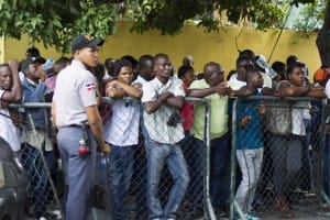 Haitians-line-up-to-legalize-status-before-midnight-deadline-Santo-Domingo-DR-061715-2-by-Erika-Santelices-AFP-web-300x200, The tragic, bloody origins of the Dominican Republic’s plan to erase much of its Black population, World News & Views 