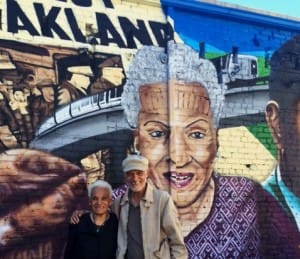 Jerri-and-Michael-Lange-in-front-of-Alice-Street-mural-300x259, Wanda’s Picks for June 2015, Culture Currents 