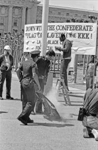 Cops-watch-Spartacist-League-and-Labor-Black-League-supporters-burn-the-Confederate-flag-SF-Civic-Center-041584-by-Workers-Vanguard-web-197x300, 1984: Confederate flag of slavery taken down from San Francisco Civic Center – 3 times!, Local News & Views 