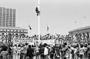 Spartacist-League-supporter-Richard-Bradley-climbs-flagpole-SF-Civic-Center-to-remove-Confederate-battle-flag-041584-by-Workers-Vanguard-web-300x197, 1984: Confederate flag of slavery taken down from San Francisco Civic Center – 3 times!, Local News & Views 