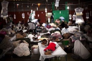 Cholera-victims-in-converted-sports-center-Cap-Haitien-2010-by-Emilio-Morenatti-AP-web-300x200, Plan Lanmó – the Death Plan: The Clintons, foreign aid and NGOs in Haiti, World News & Views 