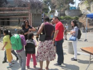 BMAGIC-Backpack-Giveaway-Jeff-Adachi-talks-w-family-Youngblood-Coleman-Park-081515-300x225, 2,000+ Bayview residents celebrate learning at BMAGIC’s backpack giveaway, Local News & Views 