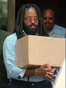 Mumia-handcuffed-carries-box-after-hearing-Philly-1995-by-Chris-Gardner-AP-228x300, Mumia Abu-Jamal’s eighth book: ‘Writing on the Wall’, Culture Currents 