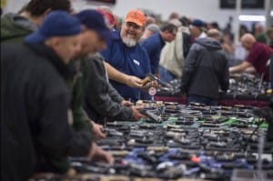 Gun-shoppers-at-Nation’s-Gun-Show-Dulles-Expo-Center-Chantilly-Va.-100315-by-Jabin-Botsford-Wash-Post-300x199, Physician Janette Sherman on US gun mania, News & Views 