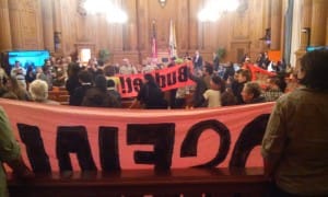 No-new-SF-jail-protesters-take-over-BOS-Budget-Cmte-120215-by-Adam-Brinklow-300x180, All eyes on San Francisco Dec. 15: Tell Supervisors to vote for NO NEW JAIL, Local News & Views 