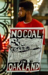 Black-man-No-coal-in-Oakland-192x300, Oakland City Council votes to ban coal exports, Local News & Views 