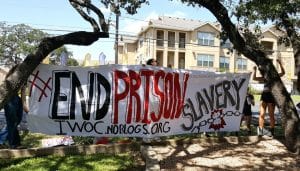 ‘End-prison-slavery’-banner-at-protest-at-Texas-Correctional-Industries’-showroom-in-south-Austin-090916-by-Kit-O’Connell-300x171, Your tax dollars make Ameri­ca a nation of 8 million slaves, Abolition Now! 