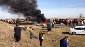NoDAPL-pipeline-path-roadblock-102816-300x165, Standing Rock: Militarized police from 5 states escalate violence, shoot horses to clear 1851 treaty camp from pipeline path, News & Views 
