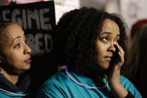 Somalis-Megitu-Argo-daughter-Ebany-Turn-protest-deportation-travel-ban-Seattle-012917-by-Jason-Redmond-AFP-300x200, BAJI: Black activists call for halt to deportation of 50,000 Haitians and 4,000 Somalis, World News & Views 