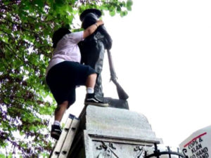 Takiyah-Thompson-climbs-ladder-to-pull-down-Confederate-statue-Durham-NC-081517-by-CBS-News-300x225, As a nation grapples with white supremacy, the Millions for Prisoners March comes at the perfect time, News & Views 