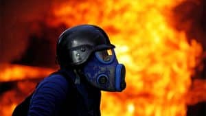 Venezuela-guarimba-in-gas-mask-fire-0817-by-Carlos-Garcia-Rawlins-Reuters-300x169, What’s REALLY happening in #Venezuela – from someone who knows, World News & Views 