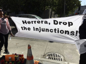 Herrera-Drop-the-Gang-Injunctions-vigil-prior-to-ct-hrg-to-remove-enjoined-men-who-died-062818-by-Daniel-Montes-Bay-City-News-web-300x225, More police, criminalization and gang suppression will not end homelessness in San Francisco, Local News & Views 