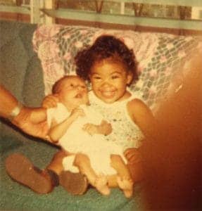 Yulanda-Williams-daughter-Nyoki-holding-Jim-Jones-grandson-Chaeoke-in-Jonestown-287x300, Jonestown genocide 40 years later, Local News & Views 