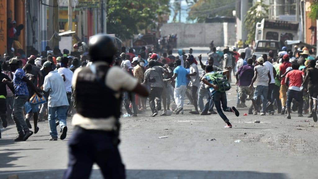 Haitian-police-open-fire-on-protesters-on-7th-day-of-protests-against-Pres-Moise-in-Port-au-Prince-021319-by-Hector-Retamal-AFP, Stand with the People’s Uprising in Haiti, World News & Views 
