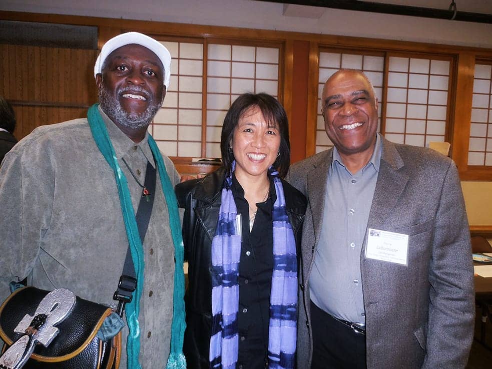 Jahahara-Rev.-Deborah-Lee-dir.-Interfaith-Movement-for-Human-Integrity-Pierre-Labossiere-at-Day-of-Remembrance-of-Japanese-internment-0219-by-Jahahara-web, Alkebulan-African HERstory and International Women’s Month Afrikans deserve Reparations! Cause, Black lives truly matter! Asé, Culture Currents 