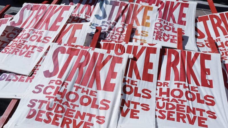 Strike-for-the-schools-that-students-deserve-picket-signs-piled-at-Frank-Ogawa-Plaza-030219-by-Jeff-Chiu-AP, Reflections of an Oakland Unified School District teacher on strike – Day 7: The strike is not over until we vote!, Local News & Views 