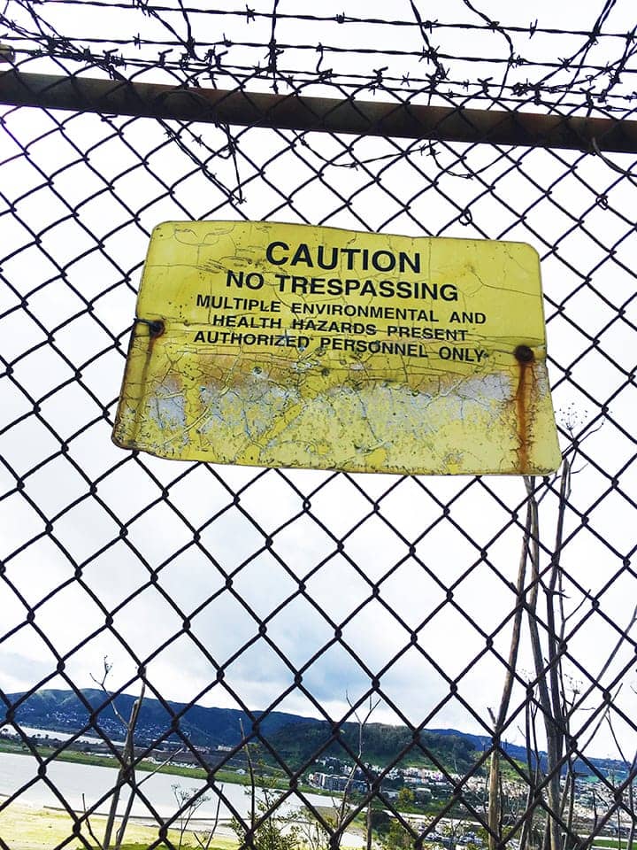 Caution-No-Trespassing-sign-on-fence-between-childrens-playground-HP-Shipyard-Superfund-site-web, Advancing environmental public health through implementation of a Biomonitoring Program at the Hunters Point Shipyard, a federal Superfund site, Local News & Views 