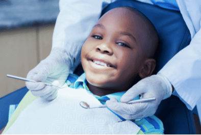 Lil-Black-boy-treated-by-dentist, CavityFreeSF aims to eliminate disparities in oral health care, Local News & Views 