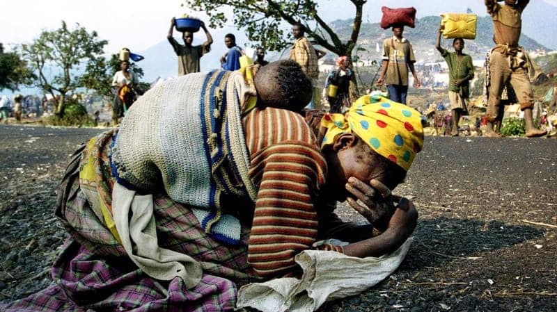 Rwandan-woman-baby-collapse-on-road-fleeing-near-Goma-Zaire-now-Congo-1994-by-Ulli-Michel-Reuters, Another African convicted in another racist, chauvinist Western court, World News & Views 