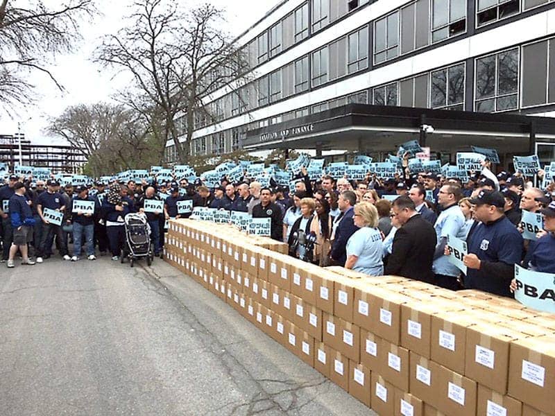 Widows-of-cops-killed-on-duty-400-cops-present-boxes-purportedly-containing-816725-parole-protest-ltrs-at-NYS-capitol-042419-by-NYC-PBA, Parole justice moves forward in New York State despite police union publicity stunt, News & Views 