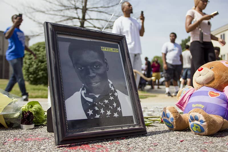 Josh-Williams-FreeJosh-framed-photo-in-Mike-Brown-memorial-by-Danny-Wicentowski, It’s not ‘try to get justice’ no more; we WILL get justice, Behind Enemy Lines 