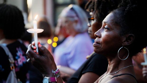 Dayton-mass-shooting-woman-holds-candle-at-vigil-next-night-at-location-080419, Mass murder, white supremacy and anti-miscegenation, News & Views 