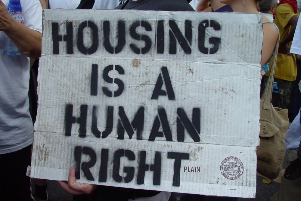 Housing-Is-a-Human-Right-hand-made-sign-at-rally, Public Housing for All, Local News & Views 