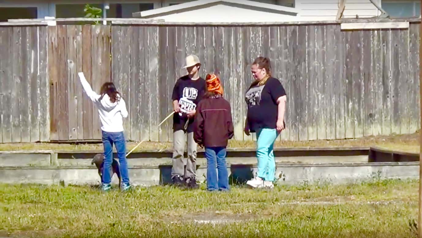 Treasure-Island-kids-puppy-play-in-toxic-area-near-sandbox-between-1220-vacant-1222-Bayside-Dr-townhouses-by-Carol-Harvey, Navy removes an estimated 163+ new radiation deposits from two toxic dumps and dangerously radioactive soil from under occupied Treasure Island home, Local News & Views 