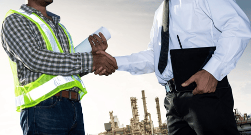 Two-Black-men-one-in-work-clothes-other-in-suit-shake-hands, Stress busters for working parents, Culture Currents 