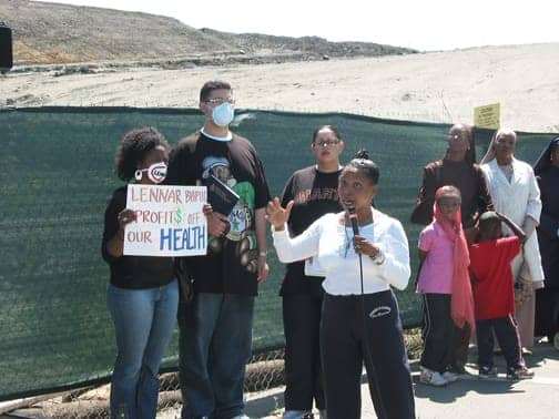 Ahimsa-speaks-at-env-justice-rally-Muhammad-Univ-next-to-Lennars-moonscape-082507-by-Chris-web, Those who must be shown: an environmental justice manifesto, Archives 1976-2008 Featured Local News & Views 