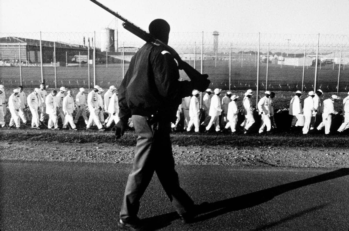 Chain-gang-marched-to-work-by-armed-guard-Limestone-CF-in-Harvest-AL-1995-by-Andrew-Holbrooke-Corbis, Unheard Voices calls for Alabama Corrections Commissioner Dunn to meet with prisoners, Behind Enemy Lines 