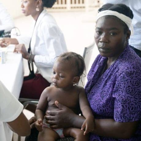 Haitian-mother-baby-in-clinic, Resisting COVID-19 in Haiti, World News & Views 