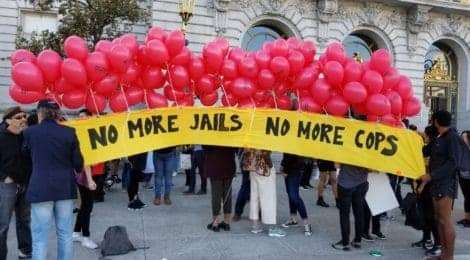 No-more-jails-no-more-cops-banner-w-balloons-outside-SF-City-Hall-by-Critical-Resistance, Closure close for notorious ‘850,’ SF County Jail, Abolition Now! 