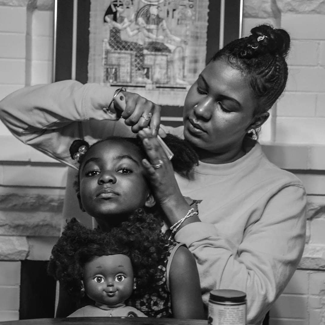 Tanafer-Camara-of-TLC-Consulting-and-Maternal-Healing-does-her-daughters-hair-by-Brittsense, Birthing Black babies during a pandemic, Local News & Views 