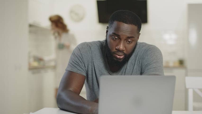 Tired-Black-man-w-laptop, Black people are so tired, Culture Currents 