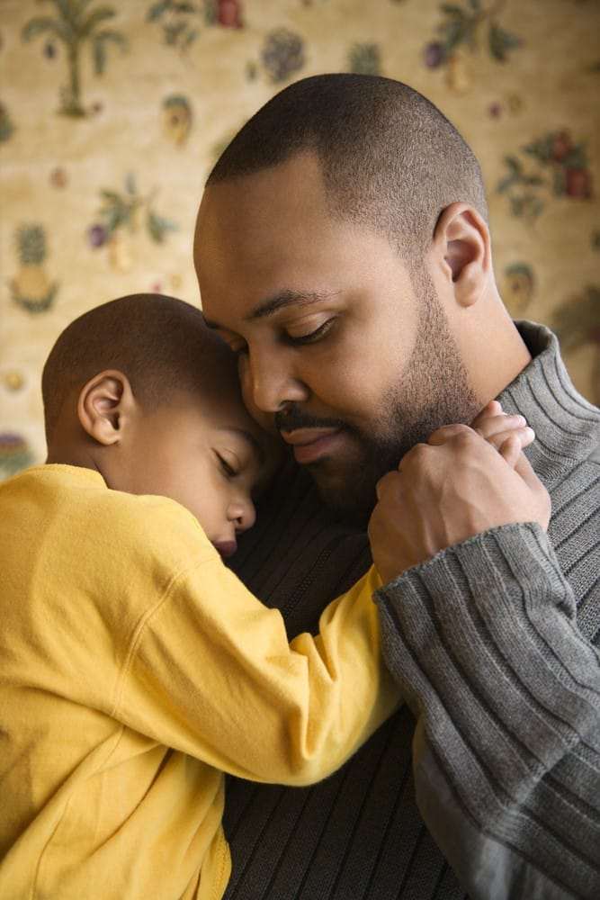 Father-comforts-lil-boy-both-Black-1, Coronavirus parenting: Protecting your children during the pandemic, Culture Currents 