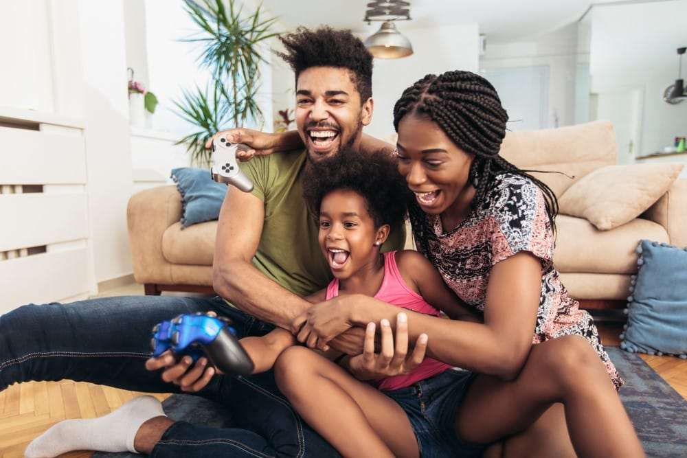 Young-Black-family-playing-video-games, Coronavirus parenting: Protecting your children during the pandemic, Culture Currents 