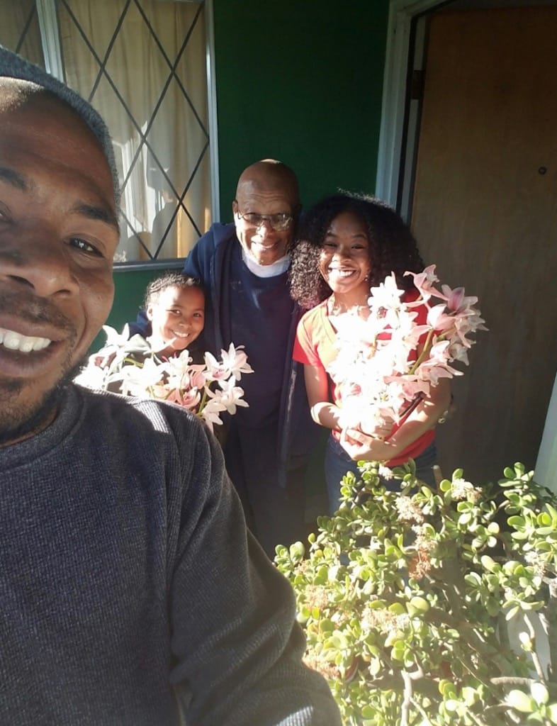 JR-Zuri-great-grandfather-Cleveland-Valrey-Xion-celebrate-blooming-of-Japanese-orchids-they-raise-in-East-Oakland-0720, A quarantine story: a short family history of my grandpa, Culture Currents 