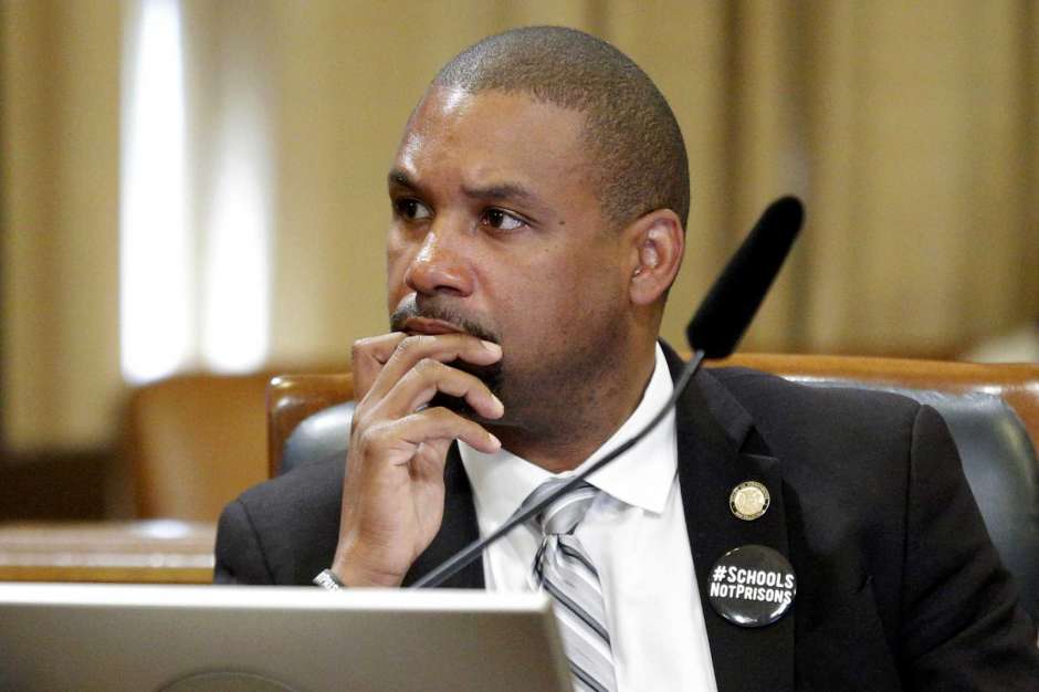Supervisor-Shamann-Walton-board-meeting-wearing-button-Schools-Not-Prisons-060419-by-Santiago-Mejia-SF-Chron, Supervisor Shamann Walton’s CAREN Act seeks to legally address the weaponization of calling 911, Local News & Views 