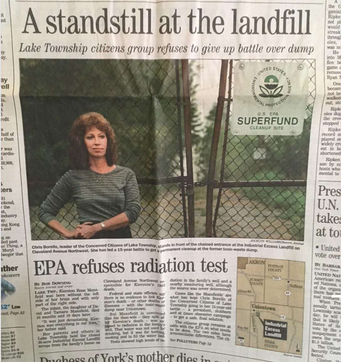 Chris-Borello-co-founder-of-Concerned-Citizens-of-Lake-Township-stands-at-Industrial-Excess-Landfill-chained-gate, 2020 hindsight brings corrupted radiation testing into focus at the EPA – Part 1, News & Views 