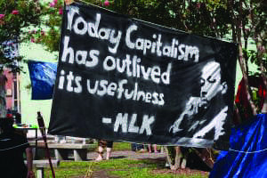 Today-capitalism-has-outlived-its-usefulness-banner-homeless-encampment, Jalil Muntaqim: Future focused in Black August 2020, Abolition Now! 