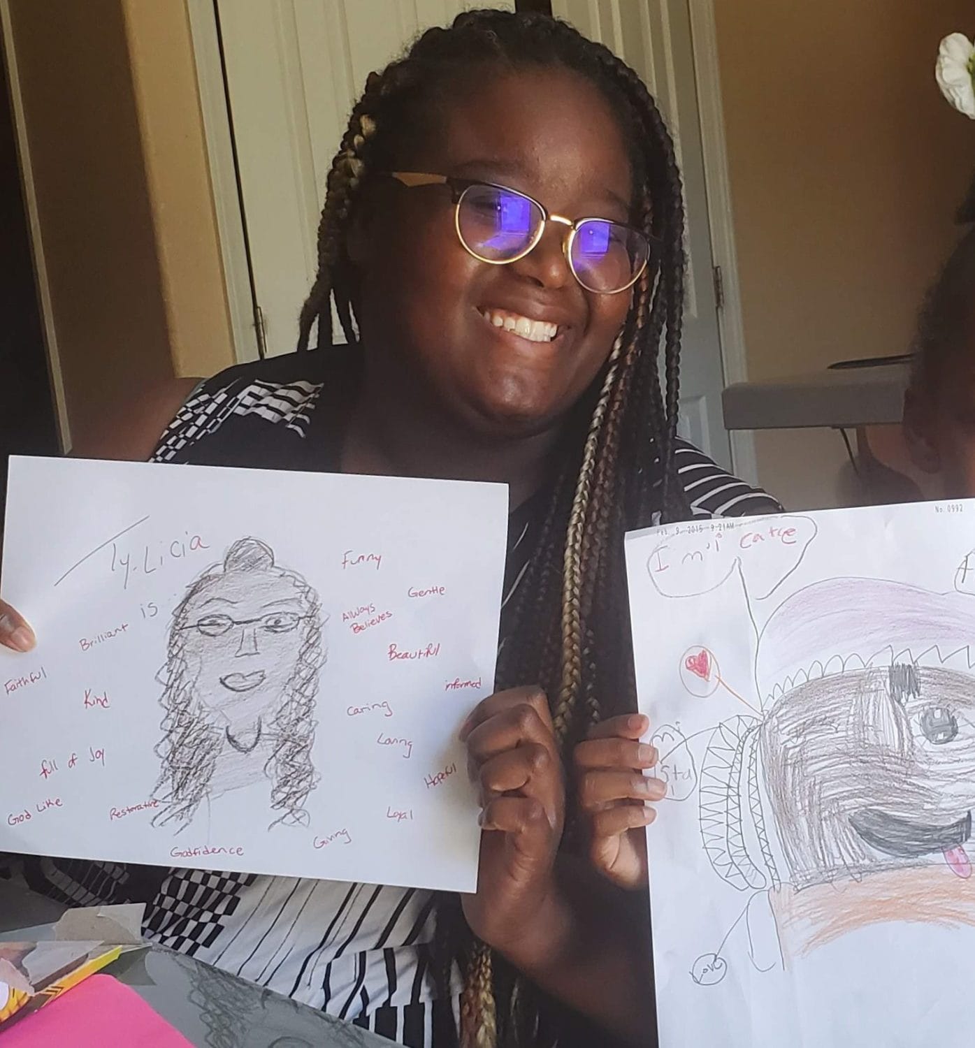 Ty-Licia-Hooker-shows-student-drawings, COVID-19: The digital education divide and its impact on low-income families, Local News & Views 