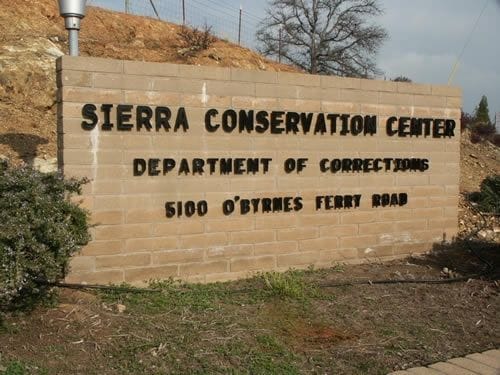 Sierra-Conservation-Center-brick-sign-outside-prison, Coronavirus quarantine means solitary confinement for prisoners, Behind Enemy Lines 